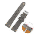 Genuine suede leather watch strap in brown on a small waist, showing texture and buckle.