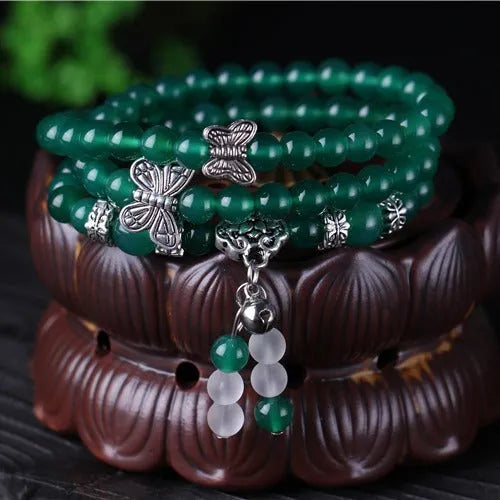 Green agate multi-layer women's bracelet with three circles of 6mm beads on an adjustable chain.