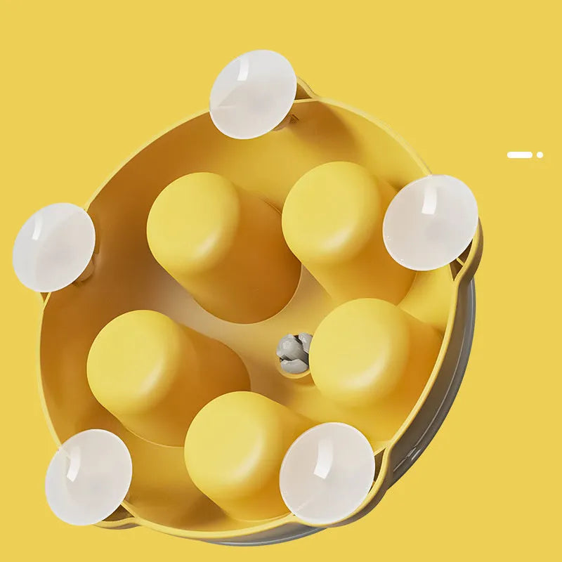 Yellow educational cat puzzle feeder bowl with adjustable difficulty compartments for treat storage