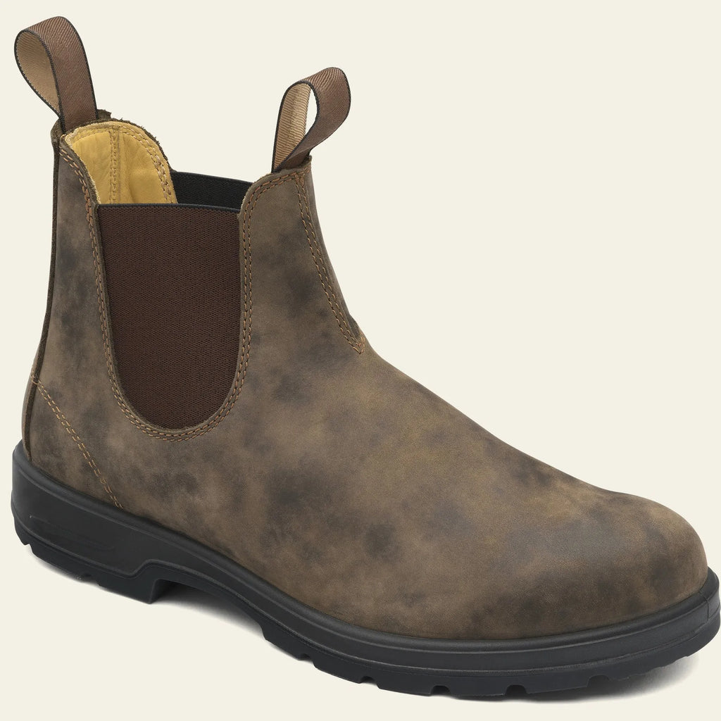 Vintage grey unisex Chelsea boots on a wooden floor, showing frosted PU upper, round toe, low heel, and car stitch detail.