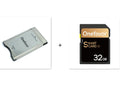 SD to PCMCIA adapter card with stainless steel housing next to a 32GB SDHC card for Mercedes-Benz vehicles