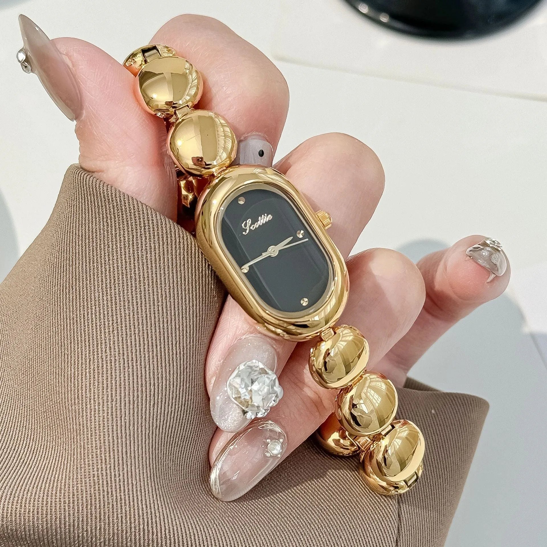Women's oval fashion watch with slim profile in gold and colour variations