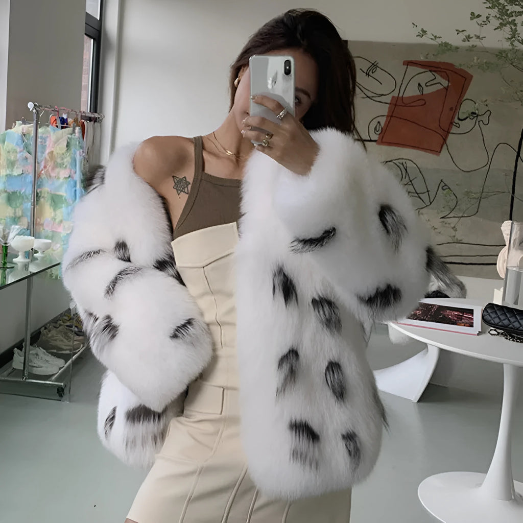 Black and white plus size women's short faux fur coat with regular sleeves.