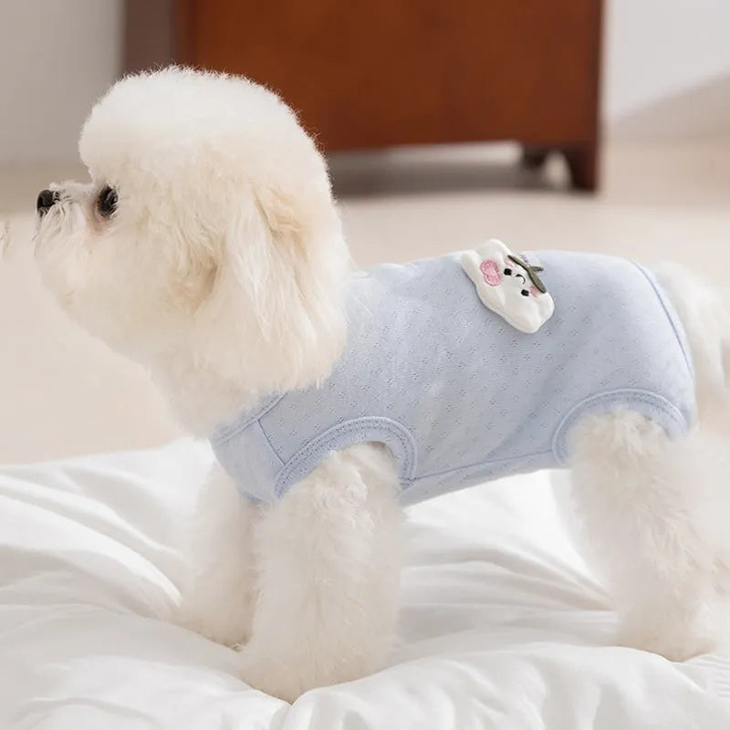 Pet shirt in soft yellow mesh fabric with cat patches and button closure on white background