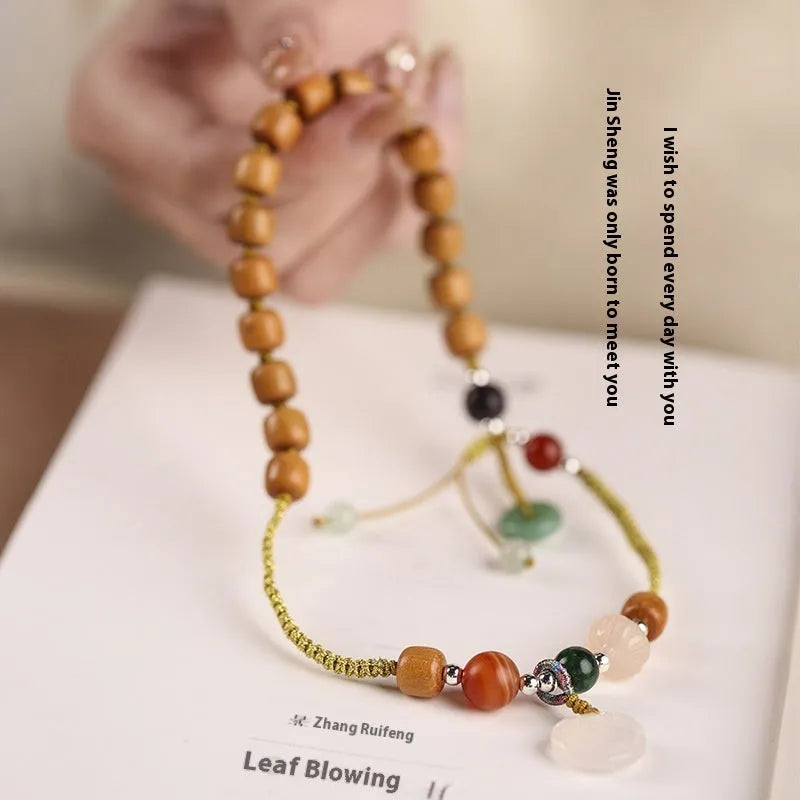 Hand-woven ebony women's bracelet with double ring design and decorative stone elements