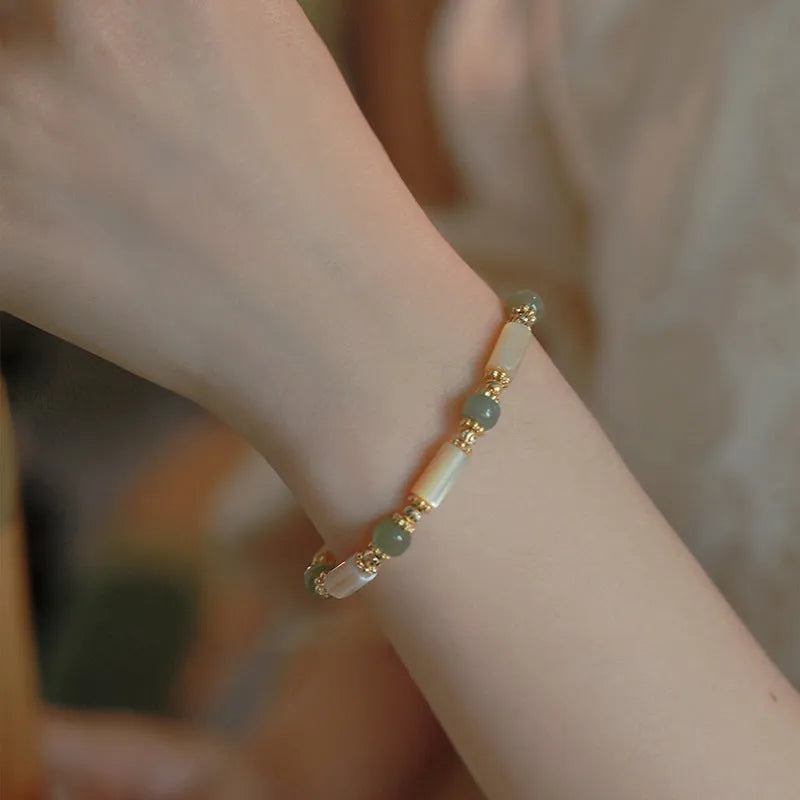 Women's Hetian jade white lip shell bracelet with round beads in simple geometric design