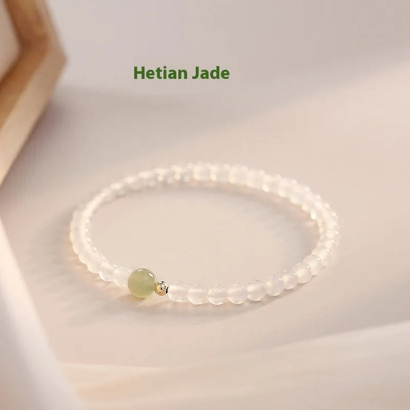 Natural white agate women's bracelet on wrist showing handmade beads and 15cm length.