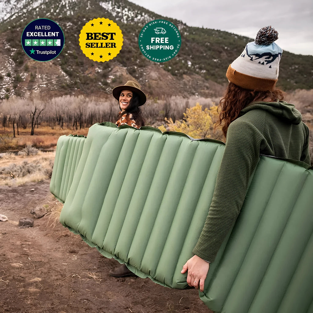 Single person inflatable camping mattress in grey colour, shown expanded to 195cm length.