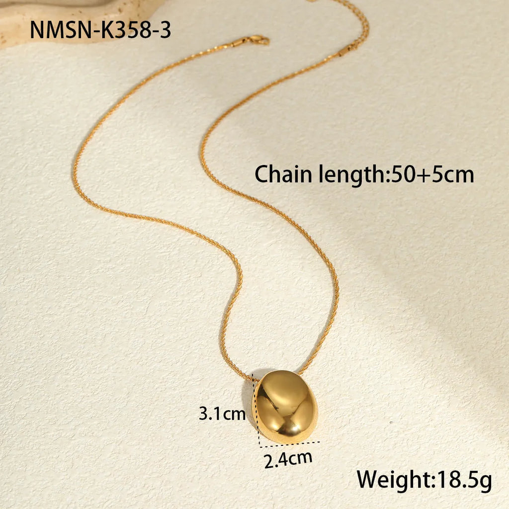 Gold geometric pendant necklace on a stainless steel chain with adjustable length.
