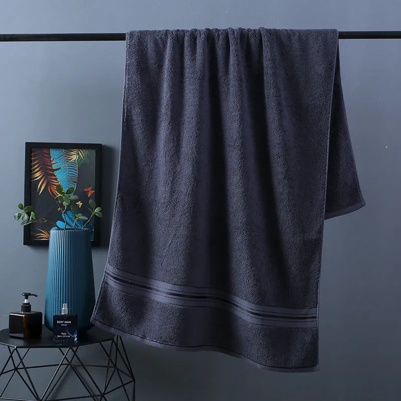 Pure cotton bath towel set showing three pieces in blue colour with floral pattern detail