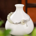 Women's antique bracelet with Hetian jade inlay and lotus peace buckle design in 925 silver