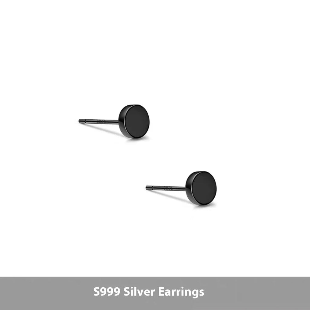 A pair of simple round flat stud earrings in sterling silver, shown in silver and black finishes.