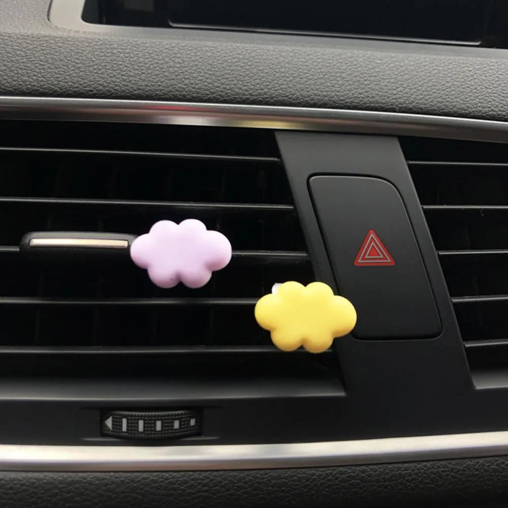 Resin Baiyun cartoon car air freshener clip in pastel colours on a car vent.
