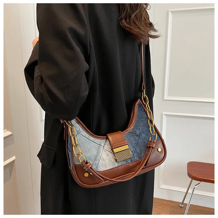 Brown denim women's shoulder bag with diamond mesh and chain detail, bucket shape.