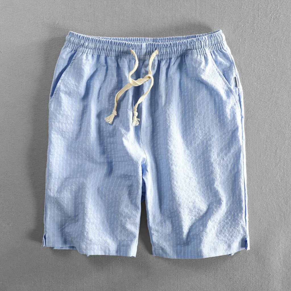 Men's striped casual shorts in a loose straight-leg style on a plain background.