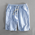 Men's striped casual shorts in a loose straight-leg style on a plain background.