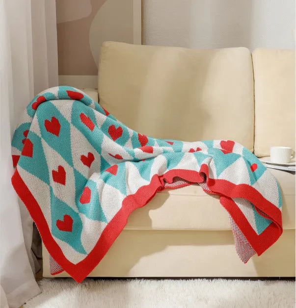 Bohemian-style acrylic knit sofa blanket with tassels in a geometric pattern