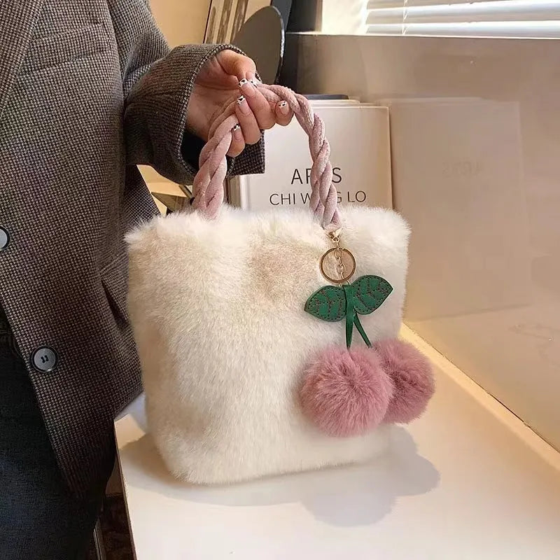 Large capacity soft plush bucket bag in beige with open outer pocket and single shoulder strap