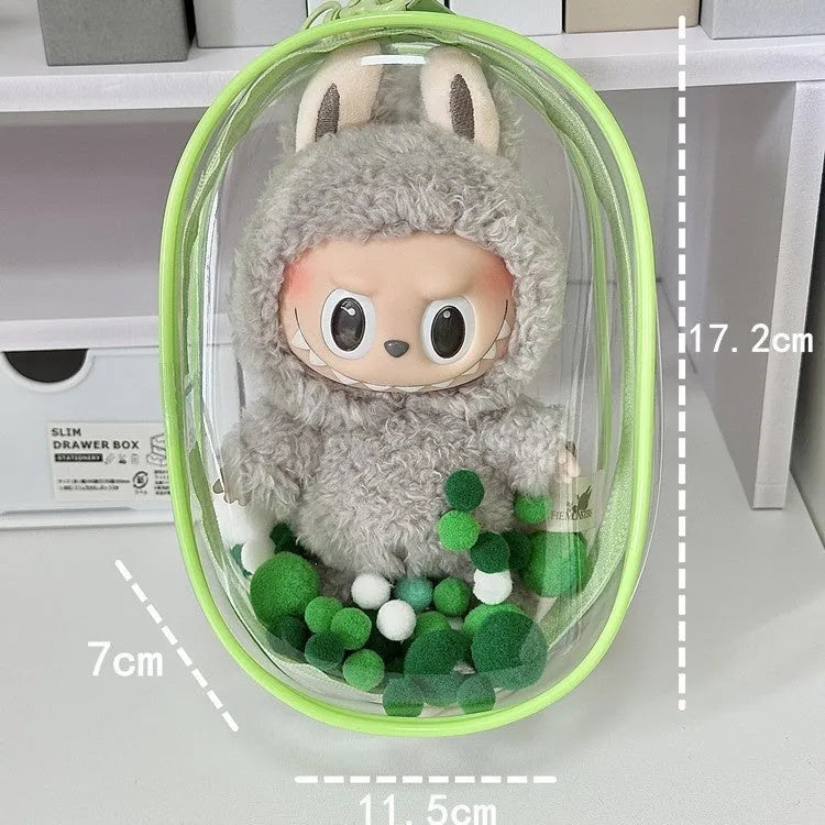 Transparent PVC cube storage bag with cartoon keychain and colourful ball in avocado green.