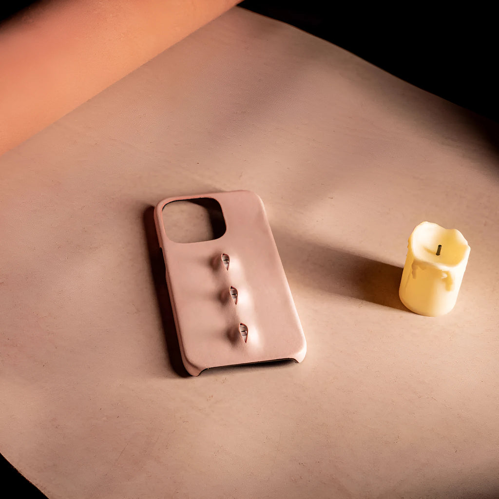Pink eye-shaped phone case in waxed vegetable-tanned cowhide with PC bottom shell for iPhone