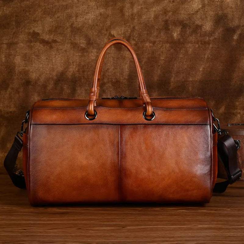 Handmade retro leather bag in vintage brown with 20L capacity and genuine leather construction