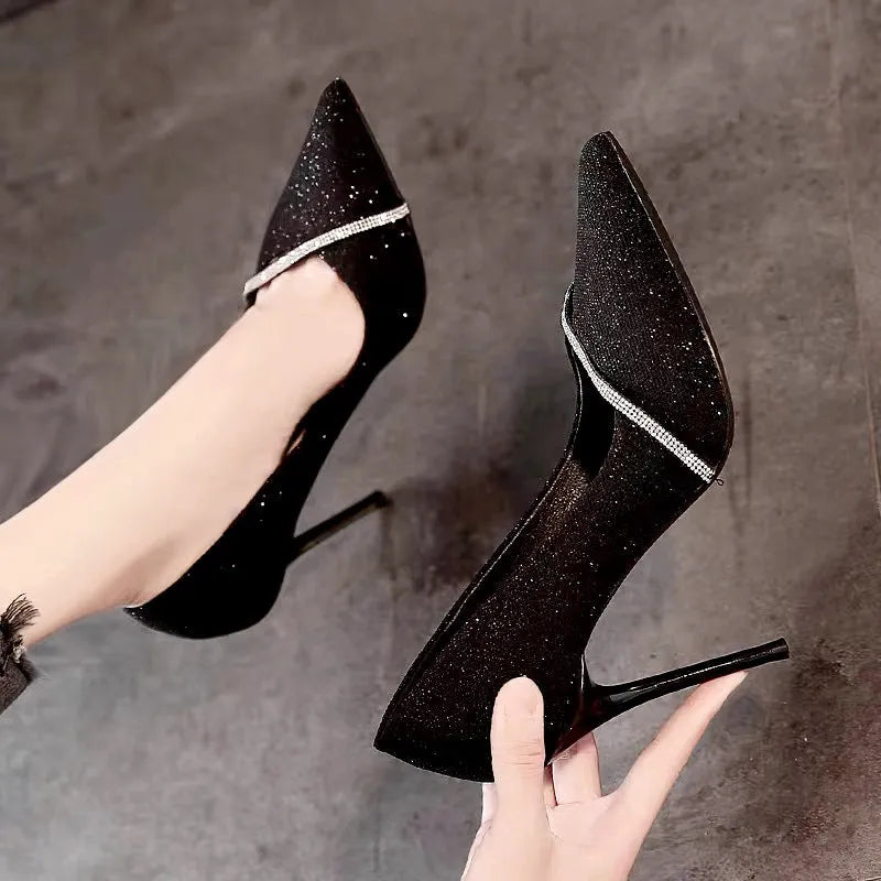 Women's black and gold stiletto pointed toe high heels with low cut design