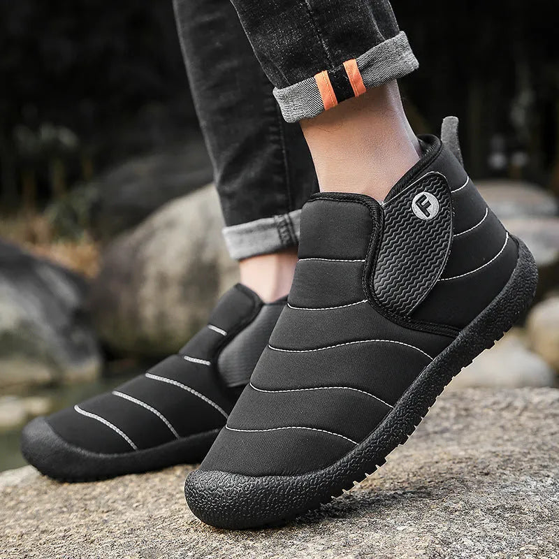 Men's waterproof cotton snow boots in black, shown with a non-slip rubber sole.