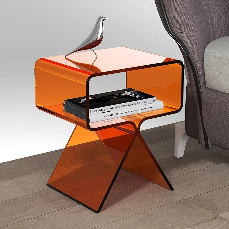 Transparent acrylic side table with bracket frame in living room setting