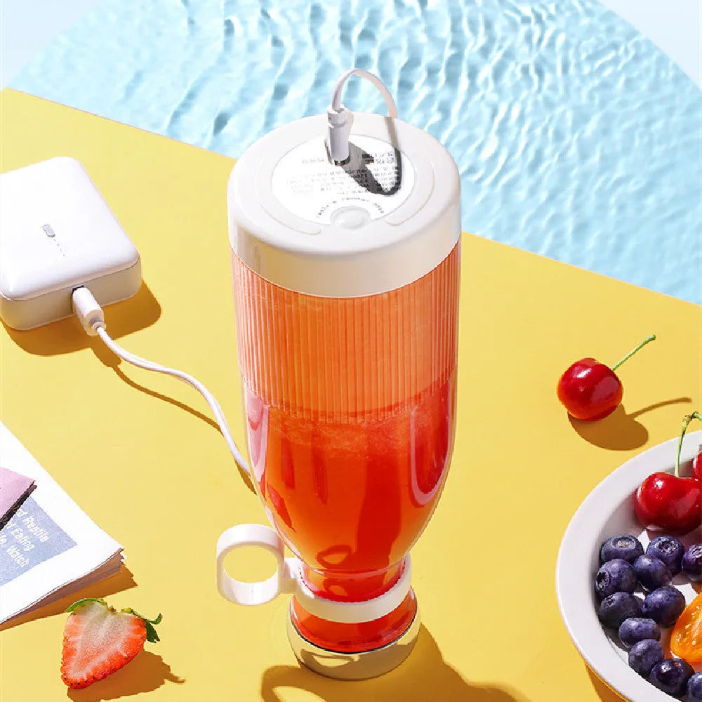 Portable USB charging juice cup in Aquarius Juicer Pink with four cutter heads and PC edible grade plastic inner liner