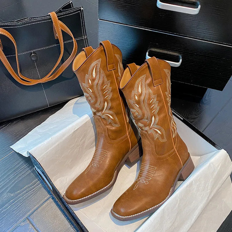 Brown women's embroidered Martin boots with mid-calf length, leather lining, and waterproof platform