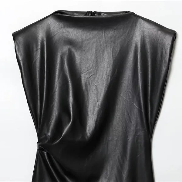 Black faux leather padded shoulder hooded short dress with long sleeves, mid waist and asymmetric pleated skirt