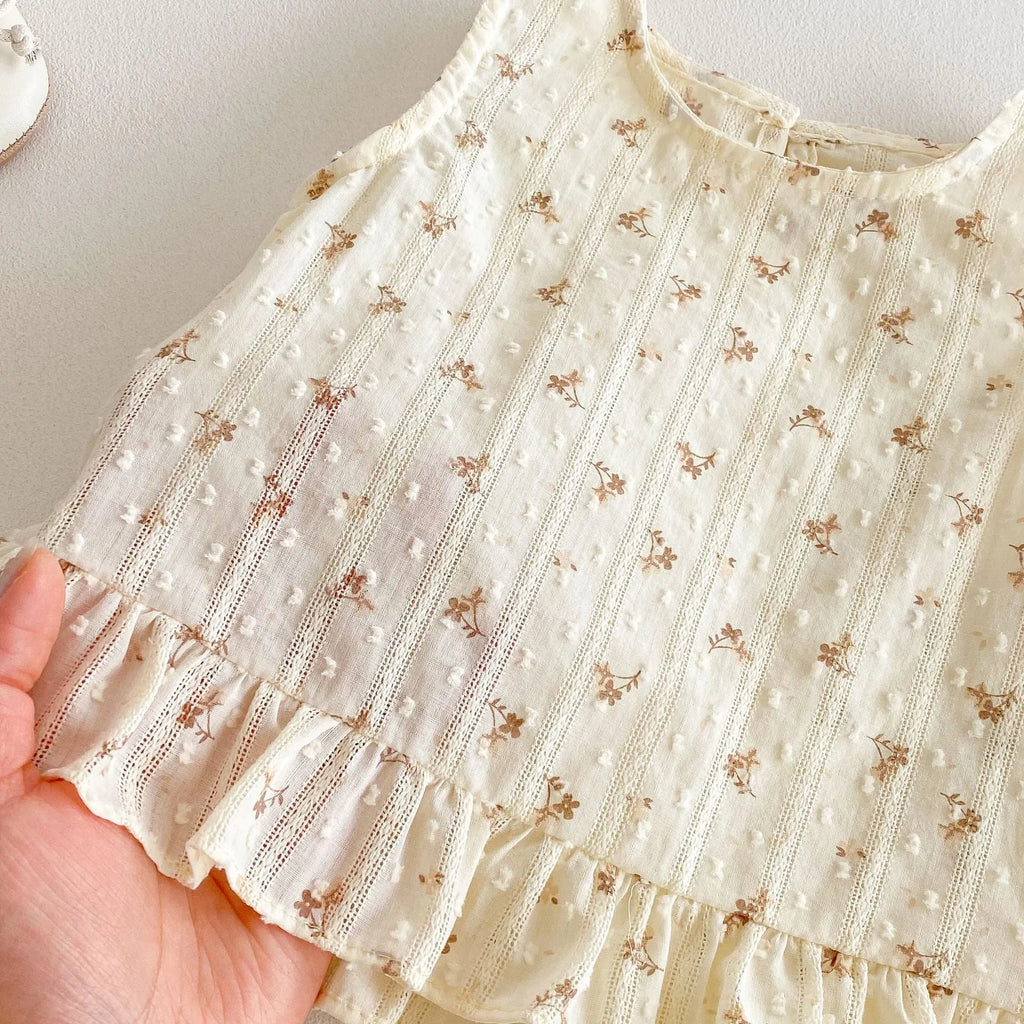 Children's cotton sleeveless top and trousers two-piece set in cream apricot on white background