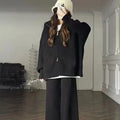 A knitted polyester zipper cardigan and wide-leg trousers two-piece set in a solid colour, laid flat.