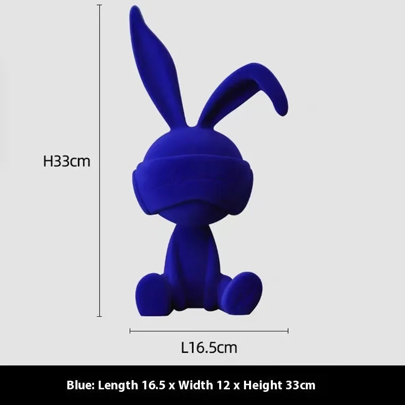 Suede blindfold rabbit resin table ornament in blue, green, or red colour.