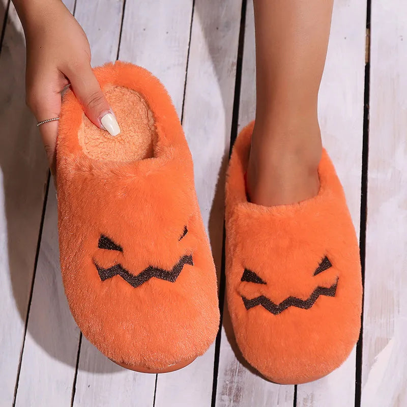 Orange women's Halloween pumpkin slippers with plush lining and a non-slip PVC sole