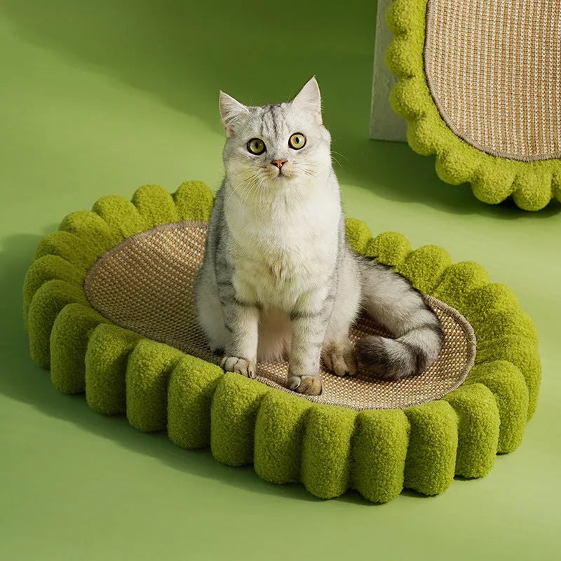 Green oval cat scratching pad and bed made from sisal fibre.