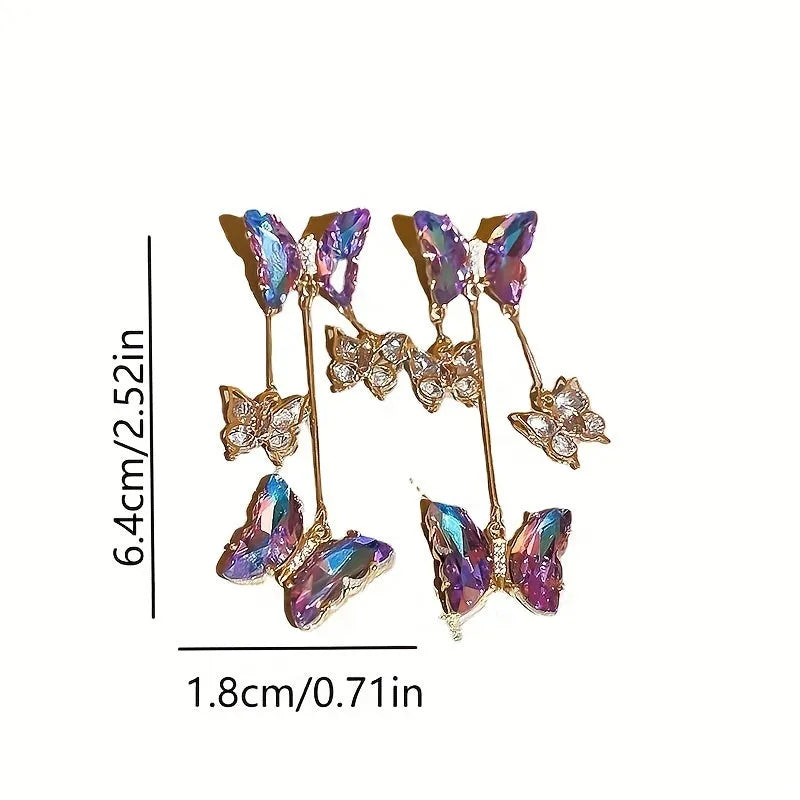 Silver needle and crystal flower earrings with blue purple butterfly tassel on alloy hooks.