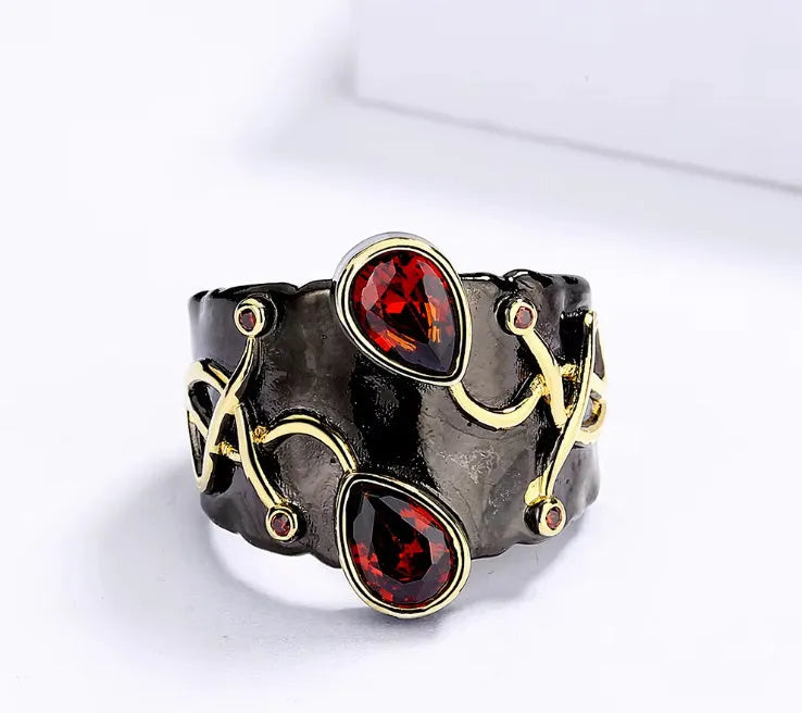Women's black brass straight-pull oval ring on a neutral background