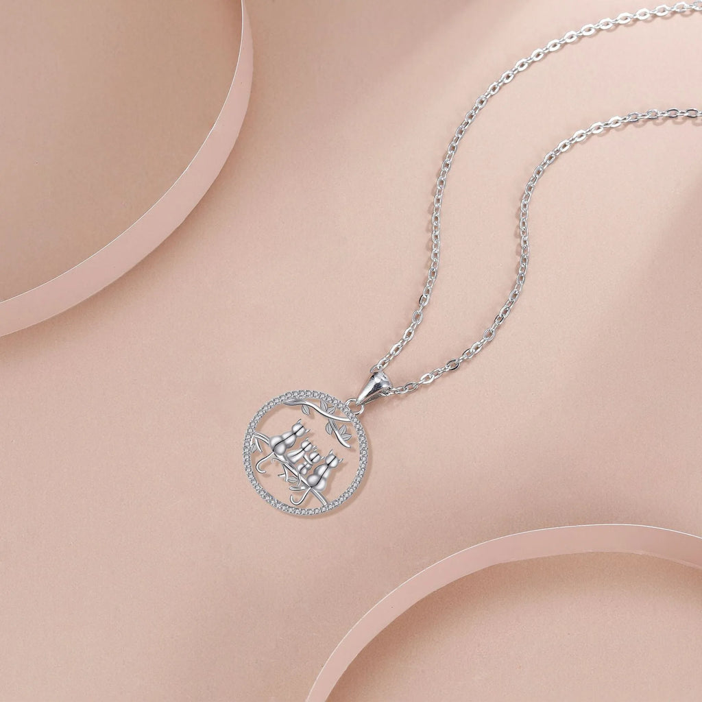 Four Kitten Necklace with copper pendant and cross chain in original design.