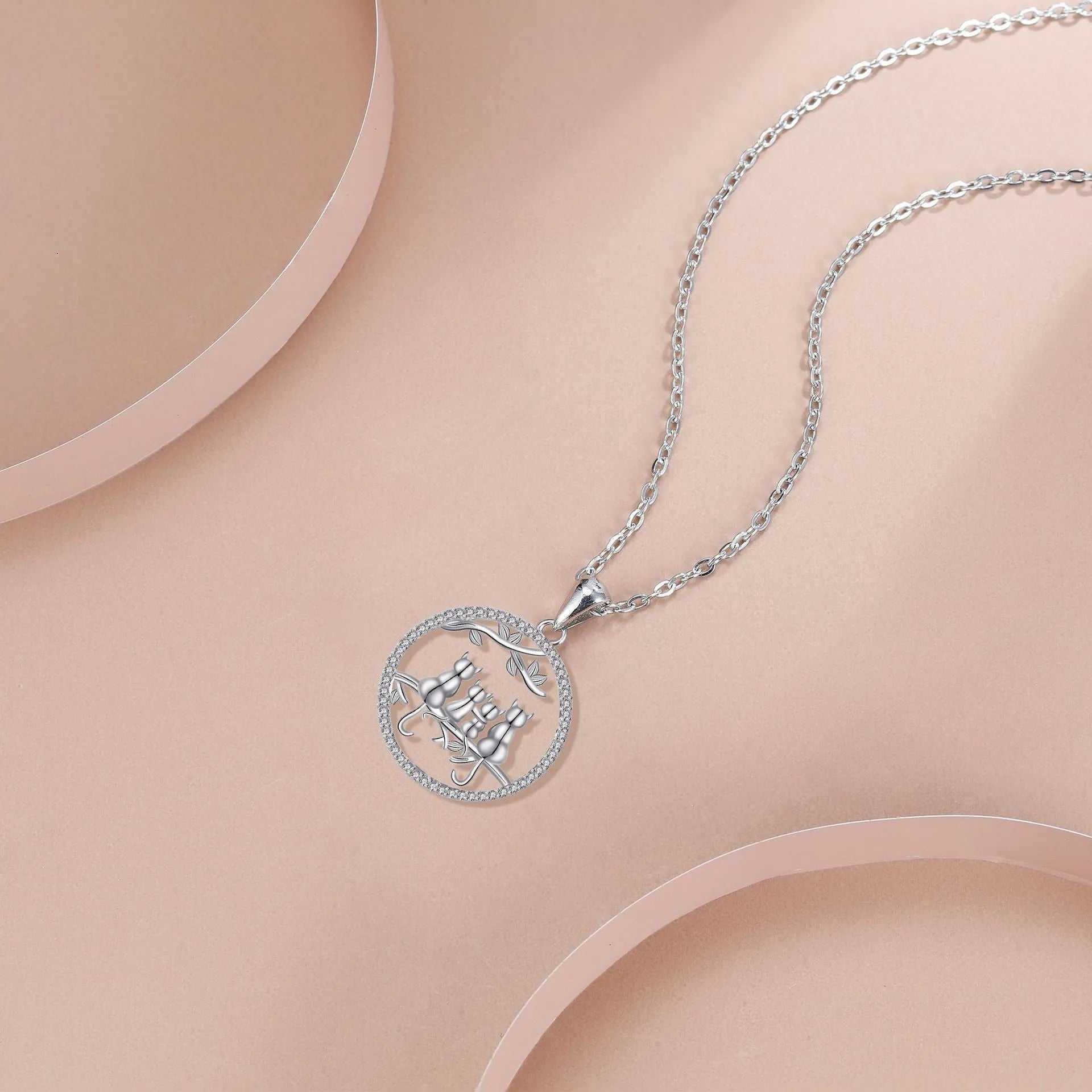 Four Kitten Necklace with copper pendant and cross chain in original design.