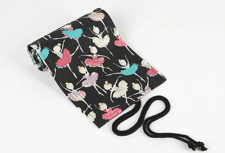 Canvas rolling pencil case with ballet girl print, showing multiple hole capacity options for colour pencils.