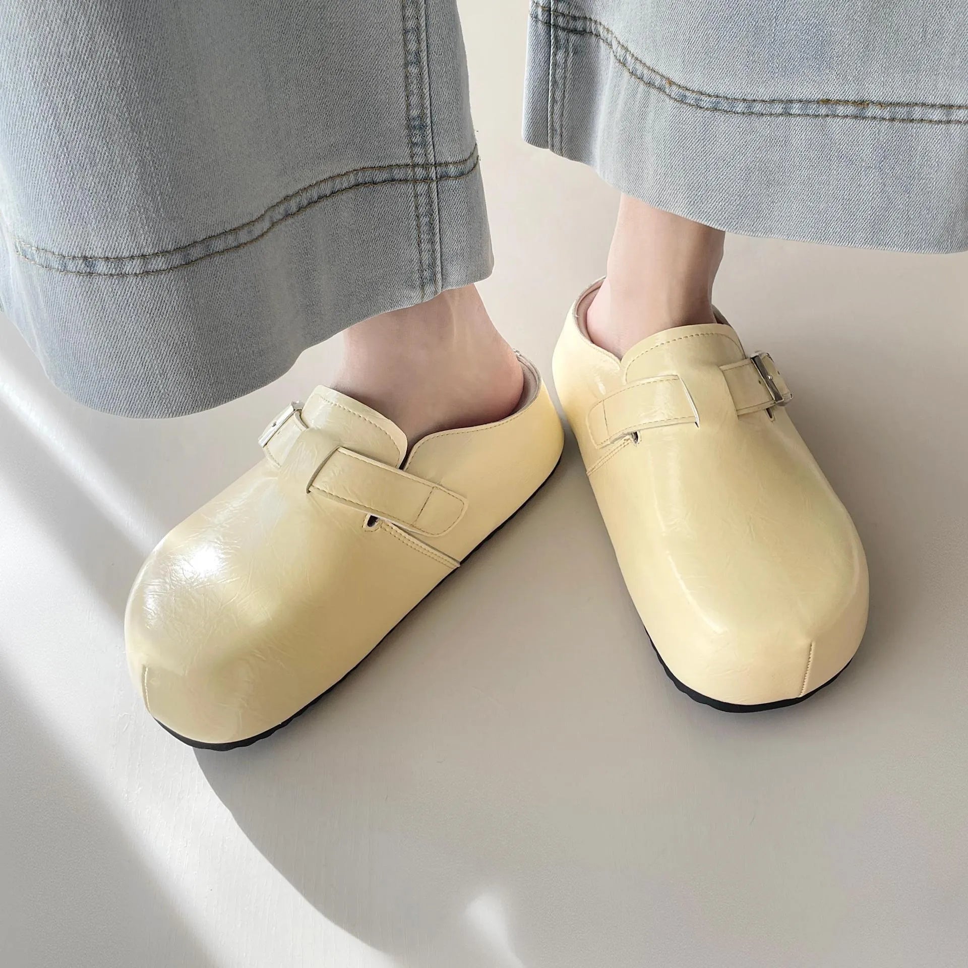 Flat buckle casual sneakers with round toe in yellow, creamy-white, silver, and black colour options
