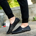 Four Seasons Gommino driving leather shoes in black with embossed upper and rubber sole