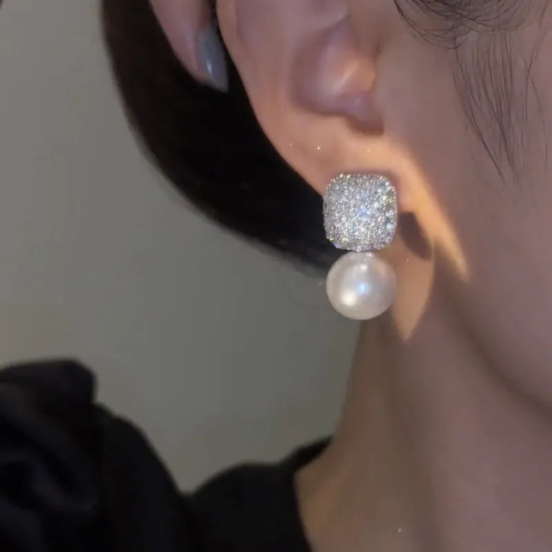 Micro inlaid zircon square pearl stud earrings with tassel detail in copper and imitation pearl, available in three colours: champagne, red, white.