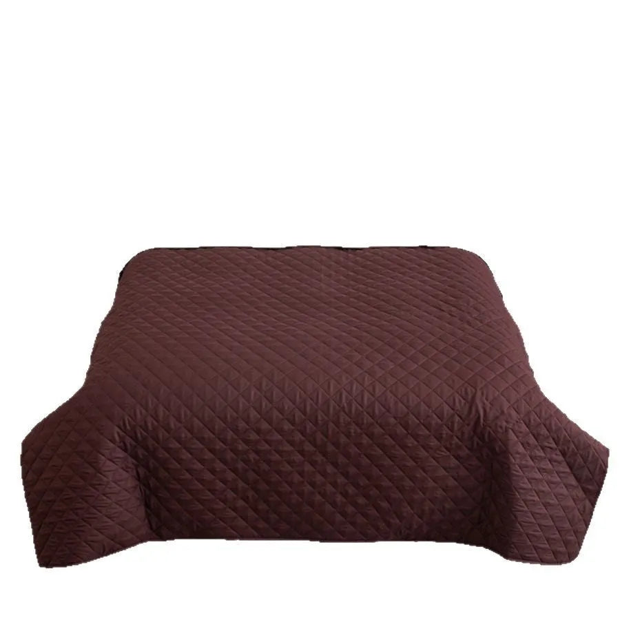 Chemical fibre bedspread with geometric pattern in black, showing sanding finish texture