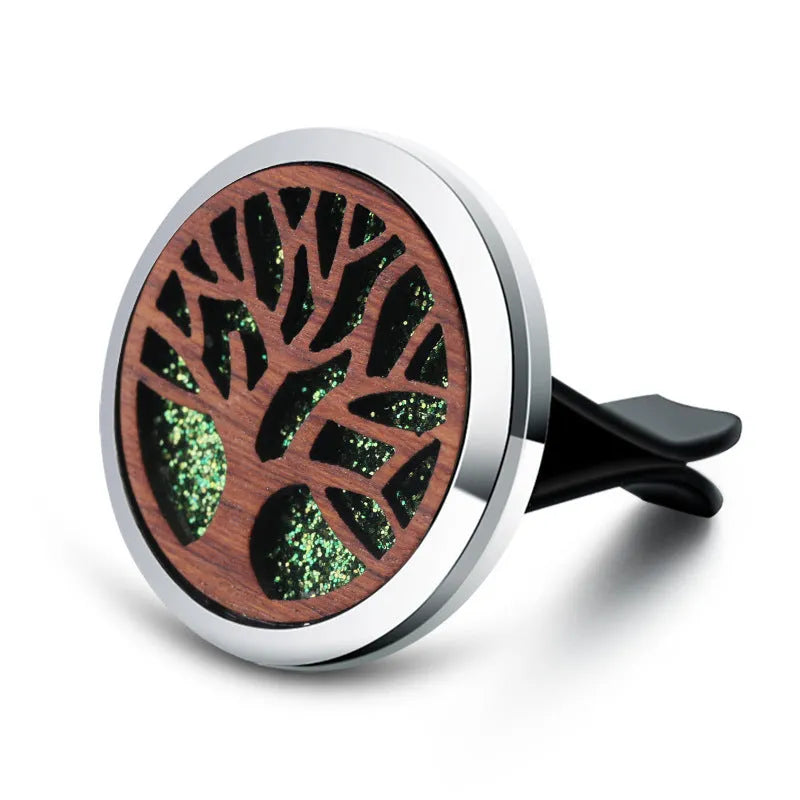 Round car vent aromatherapy clip in alloy wood construction showing hollow centre for incense