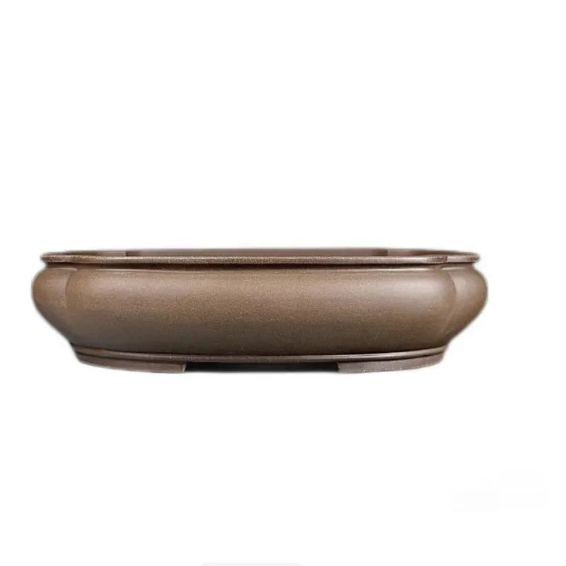 Handmade antique purple clay papaya-shaped flower pot shown from the side.
