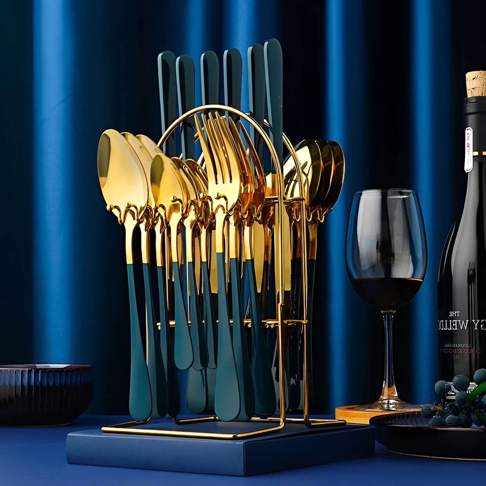 24-piece gold stainless steel cutlery set with knives, forks, spoons and storage rack