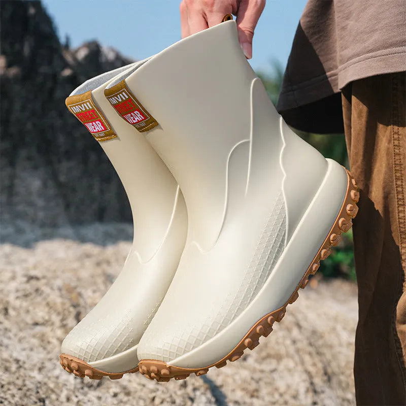 Men's PVC oversleeve rain boots in beige with a non-slip plastic sole.