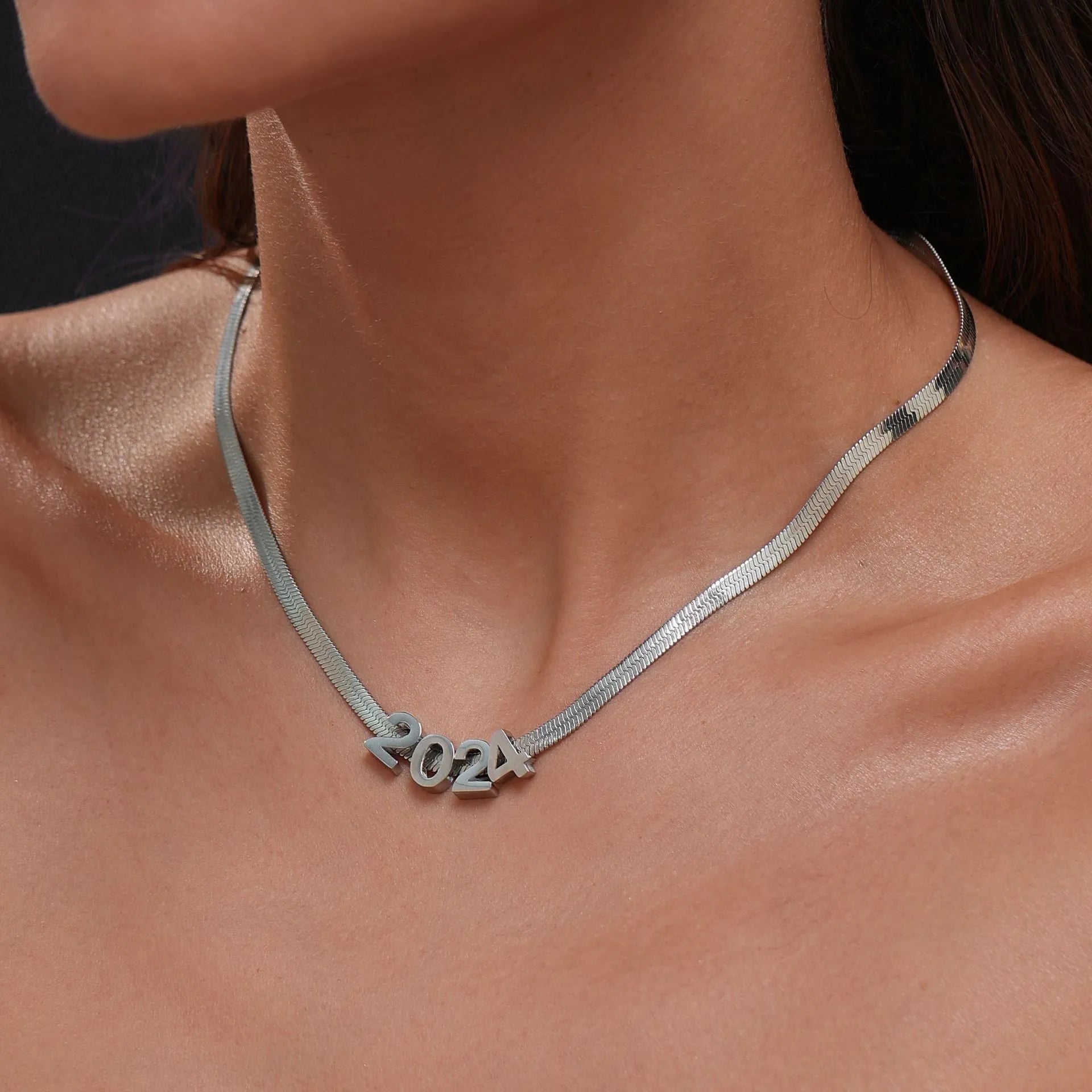 Titanium steel necklace with a personalised letter charm on a 40.5cm gold electroplated chain.